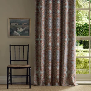 red botanical curtain with cushion and sofa