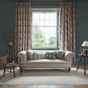 green botanical curtain with cushion and sofa