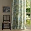 green botanical curtain with window and chair