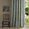 green botanical curtain with window and chair