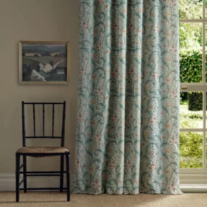 green botanical curtain with window and chair