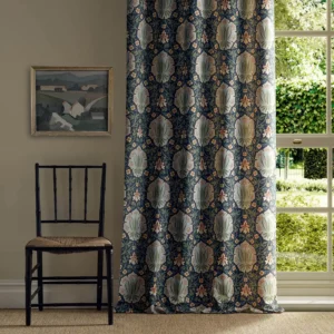 blue botanical curtain with window and chair