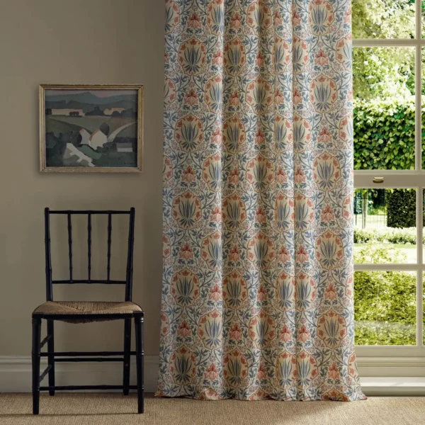 blue botanical curtain with window and chair