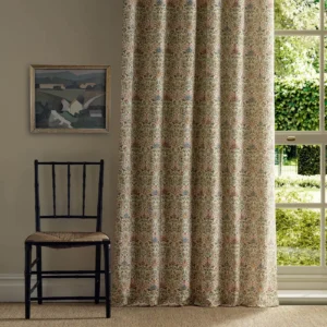 multicolour botanical curtain with window and chair