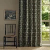 green botanical curtain with window and chair