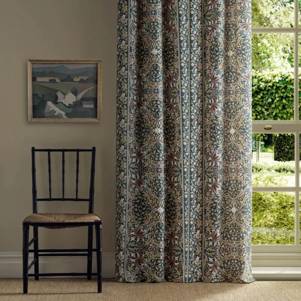 Walthamstow Fabric - Indigo / Gold by red botanical curtain with window and chair