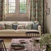 red botanical curtain with cushion and window