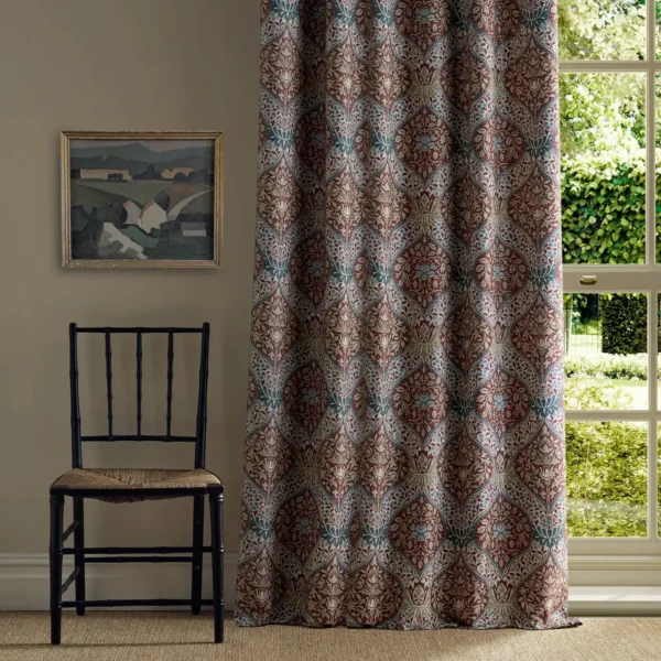 Norbury Fabric - Madder by red botanical curtain with window and chair
