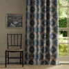 blue botanical curtain with window and chair