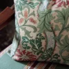 red botanical cushion with chair