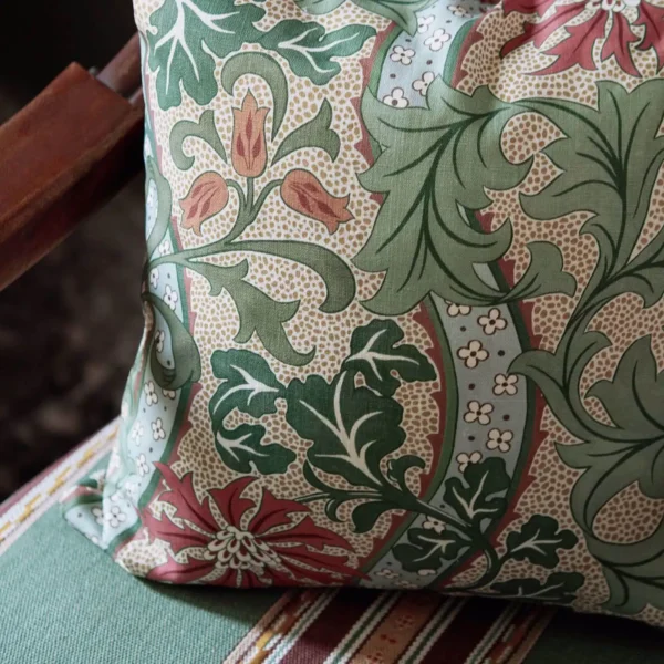 Cornflower Fabric - Russet / Forest by red botanical cushion with chair