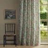 red botanical curtain with window and chair