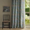 pink botanical curtain with window and chair