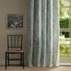 yellow botanical curtain with window and chair