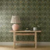 green botanical wallpaper and wall with side table and vases