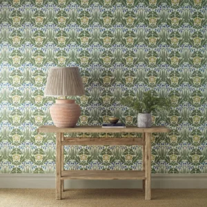 blue botanical wallpaper and wall with side table and vases