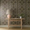 green botanical wallpaper and wall with side table and vases