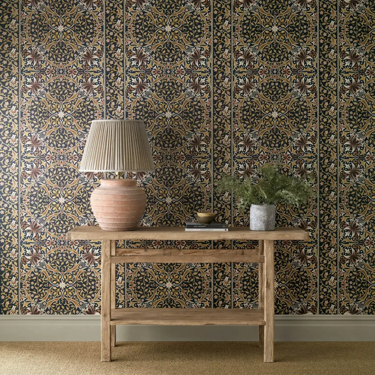 Walthamstow Wallpaper - Indigo / Gold by green botanical wallpaper and wall with side table and vases