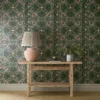 green botanical wallpaper and wall with side table and vases