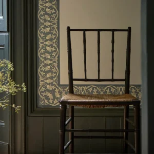 blue botanical wallpaper and wall with chair and door