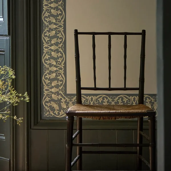 St Johns Border - River Wandle by blue botanical wallpaper and wall with chair and door