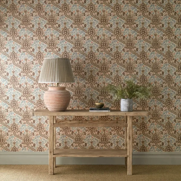blue botanical wallpaper and wall with side table and vases