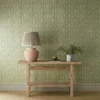 green botanical wallpaper and wall with side table and vases