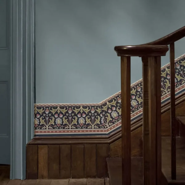 blue botanical wallpaper and wall with door