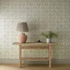 blue botanical wallpaper and wall with side table and vases