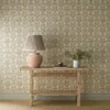 green botanical wallpaper and wall with side table and vases