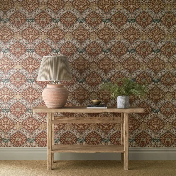 orange botanical wallpaper and wall with side table and vases