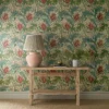 red botanical wallpaper and wall with side table and vases