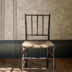 pink botanical wallpaper and wall with chair