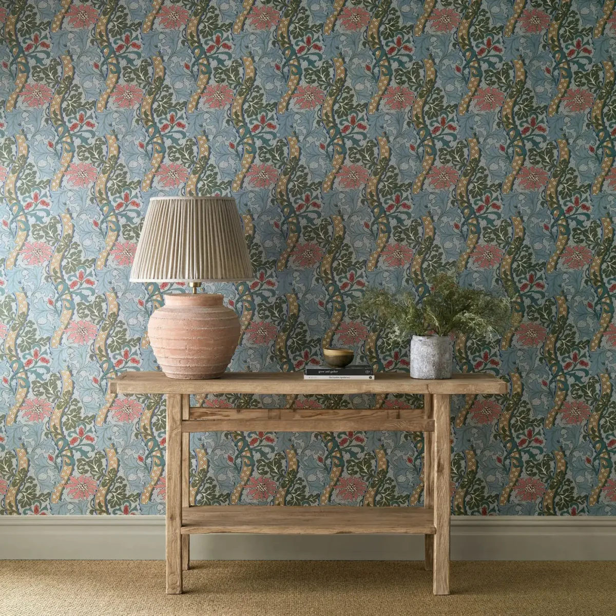 Cornflower Wallpaper - Rose / Woad by blue botanical wallpaper and wall with side table and vases