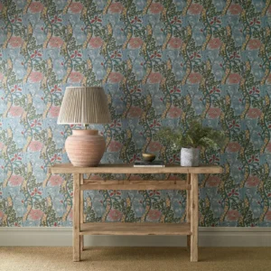 blue botanical wallpaper and wall with side table and vases