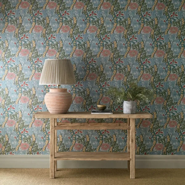 blue botanical wallpaper and wall with side table and vases