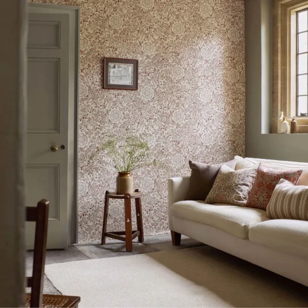 Chamomile Wallpaper - Flax / Madder by orange botanical wallpaper and wall with sofa and side table
