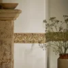 yellow botanical wallpaper and side table with door