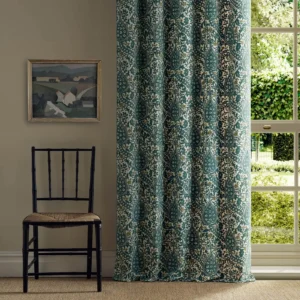 green botanical curtain with chair and window