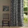 black-grey botanical curtain with chair and window