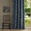 black-grey botanical curtain with chair and window
