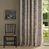 black-grey botanical curtain with chair and window