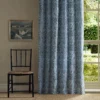 blue botanical curtain with chair and window