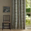 yellow botanical curtain with chair and window