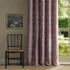 green botanical curtain with chair and window