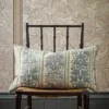 blue striped cushion with wall and chair