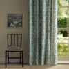 blue striped curtain with chair and window