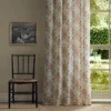blue botanical curtain with chair and window