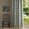 green striped curtain with window and chair
