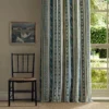 green striped curtain with window and chair